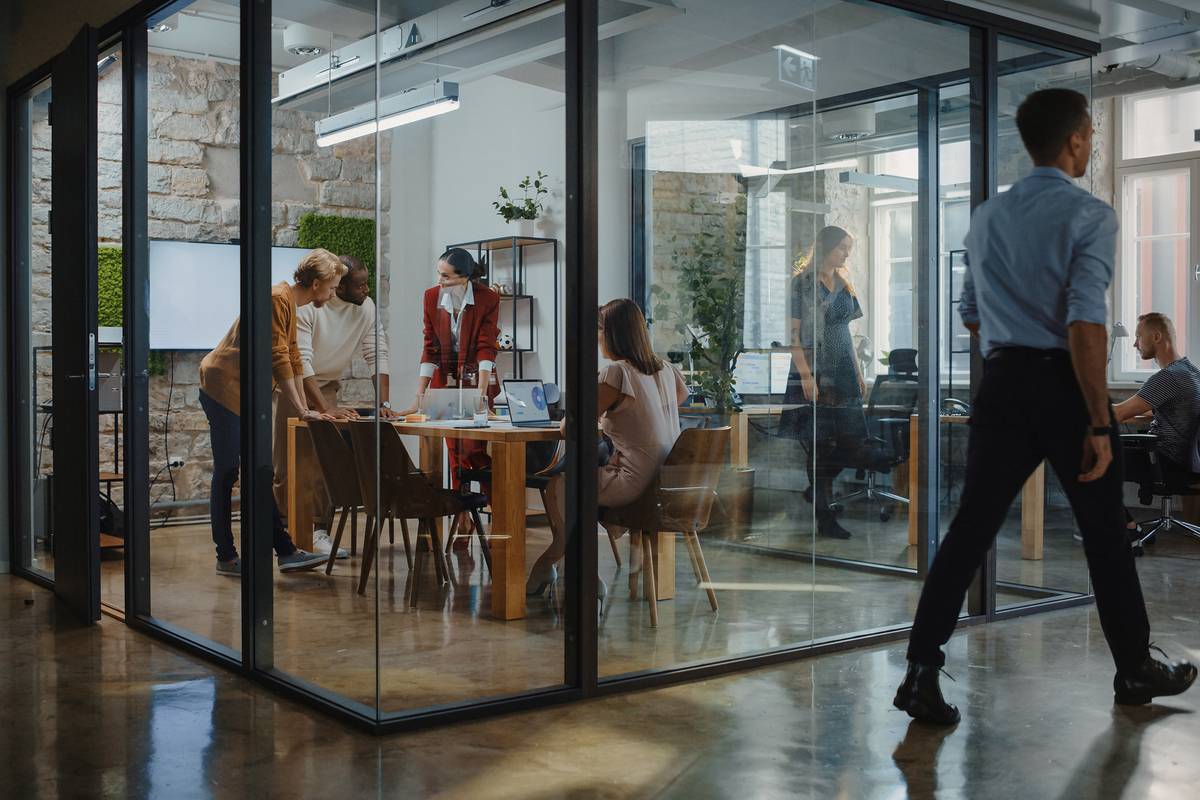 group_discussion_in_glass_conference_room_office_workspace_collaboration_communication_planning_strategy_tactics_teamwork_by_gorodenkoff_shutterstock_1919479475_2400x1600-100890809-large.jpg